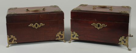 A GOOD PAIR OF GEORGE III MAHOGANY TEA CADDIES with velvet interiors and brass handles, on claw