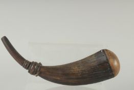 AN EARLY HORN SHAPED POWDER FLASK. 12ins high.