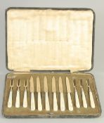 A CASED SET OF SIX MOTHER OR PEARL HANDLED KNIVES AND FORKS. Sheffield 1925.