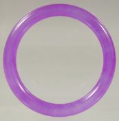 A CHINESE LAVENDER JADE BANGLE 3ins diameter.