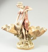 A ROYAL DUX PORCELAIN GROUP, YOUNG LADY with two shells.