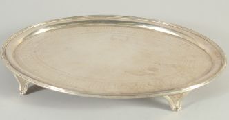 A GEORGE III ENGRAVED OVAL SILVER SALVER on four curving legs. 11.5ins long. London 1796. Maker,