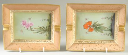 A PAIR OF HERMES PORCELAIN RECTANGULAR ASH TRAYS painted with flowers. 7.5ins x 6.5ins.