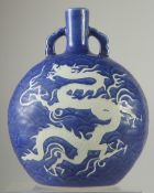 A CHINESE SACRIFICIAL BLUE AND WHITE PORCELAIN DRAGON MOON FLASK. 28ins high.