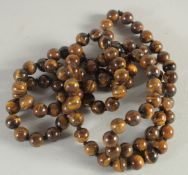A LONG STRING OF ONE HUNDRED BEADS 40ins long.