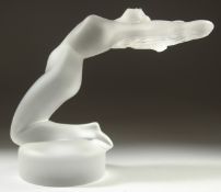 A LALIQUE GLASS NUDE on a circular base. Etched Lalique, France. 5ins high.