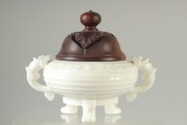 A BLANC DE CHINE PORCELAIN CENSER and hardwood cover. 18cm wide( handle to handle).