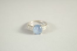 A 14CT GOLD CABOUCHEON SAPPHIRE AND DIAMOND RING. 1612.