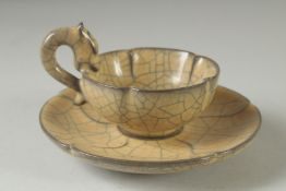 A CHINESE CRACKLE GLAZE TEACUP AND SAUCER.