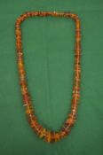 A GOOD FACETED AMBER GRADUATED NECKLACE.