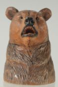 A GOOD BLACK FOREST BEAR INKWELL with hinged head. 4.5ins high.
