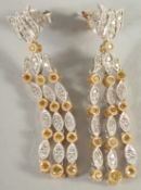 A PAIR OF 18CT WHITE GOLD. DIAMOND AND YELLOW DIAMOND DROP EARRINGS.