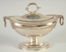 A GEORGE III OVAL SILVER SAUCE TUREEN AND COVER by PAUL STORR with gadrooned edges and ring handles.