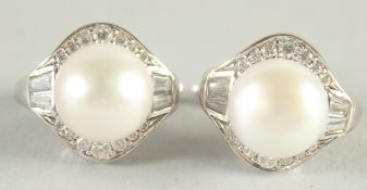A PAIR OF SILVER AND CULTURED PEARL EAR STUDS.