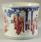 A CHINESE PORCELAIN BLUE AND RED BRUSH POT painted with figures. 6ins high.