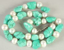 A TURQUOISE AND CULTURED PEARL NECKLACE. 16ins long.