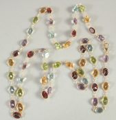 AN 18 CARAT YELLOW GOLD MULTI GEM SET NECKLACE. 65cm long.