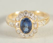 AN 18CT YELLOW GOLD CLASSIC DESIGN SAPPHIRE AND DIAMOND RING.