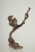 A SMALL JAPANESE BRONZE BIRD ON A BRANCH.