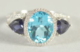 AN UNUSUAL 18CT WHITE GOLD, TOPAZ, IOLITE AND DIAMOND RING.