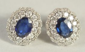 A PAIR OF FIVE OVAL SAPPHIRE AND DIAMOND 18CT GOLD CLUSTER EARRINGS.