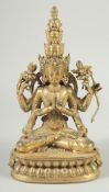 A GOOD GILT BRONZE FIGURE PRAYING set with coral. 11ins high.
