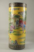 A CHINESE PORCELAIN YELLOW GROUND STICK STAND. 23ins high.