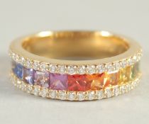 AN 18CT YELLOW GOLD MULTI-COLOURED SAPPHIRE HALF HOOP RING.
