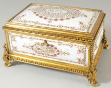 A SUPERB EMERALD AND GILT METAL FITTED JEWELLRY BOX with white enamel panels and inner fittings 9ins