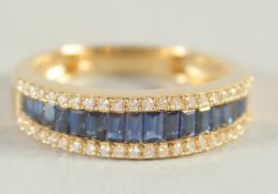 AN 18CT YELLOW GOLD, SAPPHIRE AND DIAMOND HALF LOOP RING.