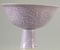 A CHINESE PURPLE GLAZE CARVED DRAGON STEM CUP.