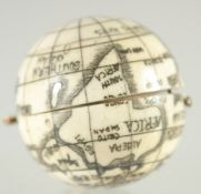 A CARVED BONE BALL COMPASS. 1.5ins diameter.