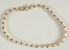 AN 18CT YELLOW GOLD, SAPPHIRE AND DIAMOND LINE BRACELET.