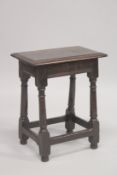 A 17TH CENTURY OAK JOINT STOOL with rectangular top, turned leg and a plain uniting stretchers.