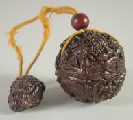 A JAPANESE CARVED WOOD BALL INRO AND ROPE carved with insects. 2ins diameter.