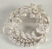 A PLATINUM AND DIAMOND FLORAL BROOCH, diamonds approx. 5 carats.