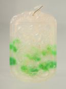 A TWO TONE JADE PENDANT.