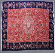 A VERY GOOD ISLAMIC CARPET, 20TH CENTURY, salmon pink with a rich blue border, having an allover