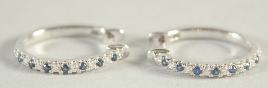 A PAIR OF 18 CT WHITE GOLD, SAPPHIRE AND DIAMOND HOOP EARRING.