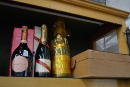 A bottle of Laurent Perrier rose Champagne, boxed, bottle of Mumm Champagne, boxed and a magnum of