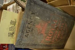 An insurance company brass plaque and other items.