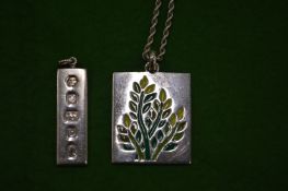 A silver and enamel pendant and chain and a silver Hallmark pendant.