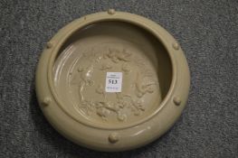 A Chinese molded pottery circular brush washer.