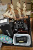 A pair of binoculars, a monocular, model train, model ship and a stylish flask.