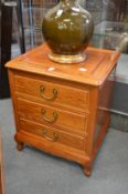 A Chinese hardwood three drawer chest.