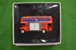 A novelty double decker bedside clock.