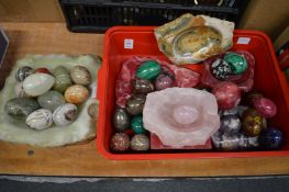 Collection of hardstone eggs and similar items.