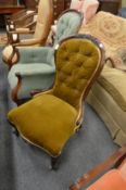 A Victorian mahogany framed button upholstered nursing chair.