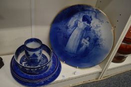 A large Doulton cabinet plate depicting mother and child together with other blue and white china.