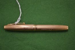 A 9ct gold Waterman fountain pen.